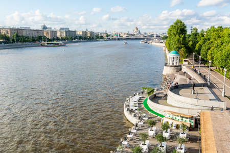 Moscow, Russia â July 3, 2017. View of Pushkinskaya Embankment along the Moskva River and Olive Beach area at the Gorky Park in Moscow. View with people in summer.のeditorial素材