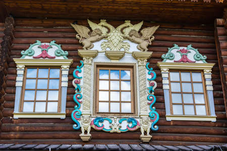 Moscow, Russia â July 6, 2017. Colorful ornate window of the reconstructed version of the Great Wooden Palace at the Kolomenskoe museum-reserve in Moscow. The palace reconstruction was completed in 2010.のeditorial素材