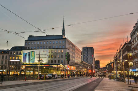 Stockholm, Sweden - November 17, 2018. Street view on Klarabergsgatan street in Stockholm, with residential and commercial buildings, commercial properties, street traffic and blurred figures of people.のeditorial素材