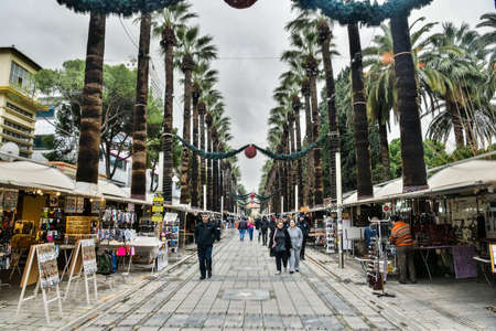 Izmir, Turkey - January 26, 2019. Sevgi Yolu (Love Street) in Izmir, with people, shops and palm trees.のeditorial素材