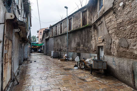 Izmir, Turkey - January 26, 2019. Backstreet of Kemeralti market in Izmir, with Hevra synagogue and commercial properties.のeditorial素材