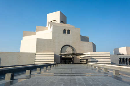 Doha, Qatar - November 9, 2016. Exterior view of the Museum of Islamic Art in Doha, with palm trees.のeditorial素材