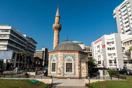 Izmir, Turkey - March 1, 2019. Exterior view of Yali Camii mosque on Konak square in Izmir, with surrounding buildings and people.のeditorial素材