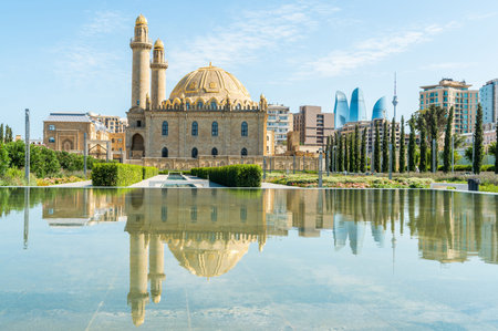 Baku, Azerbaijan â€“ July 26, 2020. Twin minaretted Teze Pir mosque in Baku. View with...