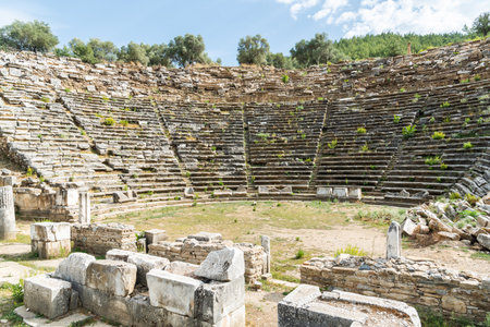 The amphitheatre of Stratonikeia ancient site in Mugla, Turkey. Stratonikeia was one of the most important towns in the interior of ancient Caria. The theater was built on a natural slope of the Kadikule Hill in the southern part of the city. The Greco-Roman type of theater is one of the structures known to date from the Hellenistic period. Based on the estimations through its present day remains, it must have hosted approximately 12.000 people.の写真素材