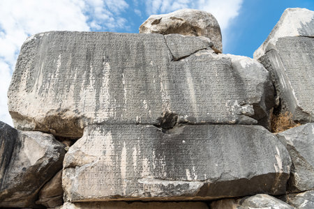Eskihisar, Mugla, Turkey â October 7, 2020. Ancient Greek inscriptions on the walls of council house Bouleuterion of Stratonikeia ancient site in Mugla, Turkey. These inscriptions list the names and durations of the months in the calendar made by Menippのeditorial素材