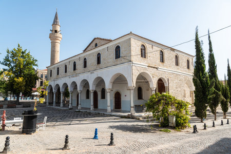 Alacati, Izmir, Turkey â October 4, 2020. Alacati Pazaryeri mosque, dating from 1874, in Alacati resort town town of Izmir province in Turkey. The building was converted from a Greek church.のeditorial素材