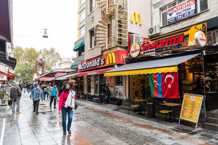 Istanbul, Turkey â November 15, 2020. Muhurdar Caddesi street in Kadikoy neighborhood of Istanbul. View with commercial properties and people, on a cloudy day.のeditorial素材