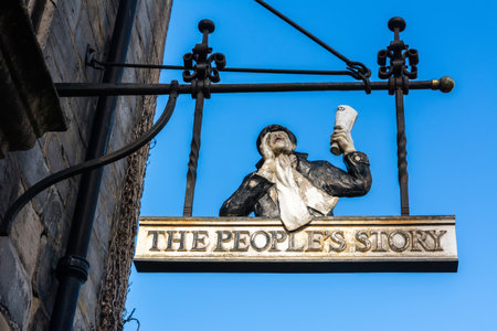 Edinburgh, United Kingdom â September 8, 2017. Sign at the entrance to Peopleâs Story museum on Canongate street in Edinburgh. The museum covers the life, work and pastimes of ordinary Edinburgh folk from the 18th century to today.のeditorial素材