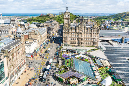 Edinburgh, United Kingdom â September 8, 2017. View over Princess Street in Edinburgh, toward Calton Hill, Balmoral Hotel and Waverley Mall. View with people, commercial properties and street traffic.のeditorial素材