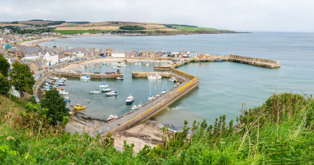 Stonehaven, Scotland, United Kingdom â September 15, 2017. View over the harbour in Stonehaven, Scotland. View with boats, historic buildings and cars.のeditorial素材