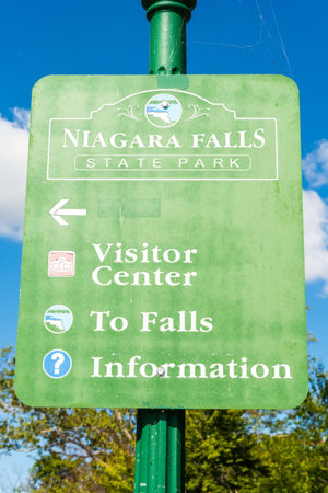 Niagara Falls, New York, United States of America â September 12, 2016. Niagara Falls State Park sign. Sign plate with directions to the Visitor Center, Falls and Information.のeditorial素材
