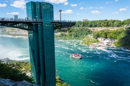Niagara Falls, New York, United States of America â September 12, 2016. View of the Prospect Point Observation Tower at Niagara Falls from the Hennepin View point. The tower, constructed of aluminum, glass, and steel, stands at 86 m with the base at theのeditorial素材