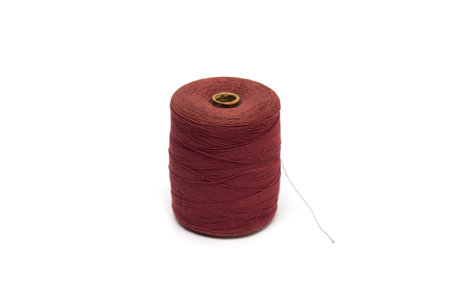Spool of red thread. Photo.
