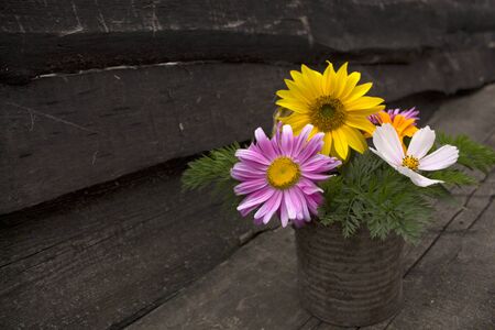 Bouquet of colorful flowers on a wooden board. Photo.の写真素材
