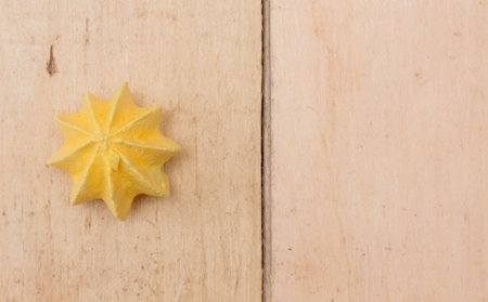 Yellow, sweet, crispy meringue on a wooden background.の写真素材