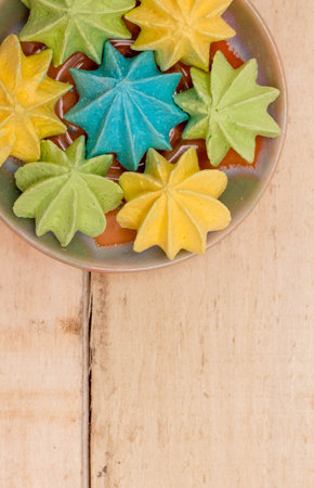 Sweet, crispy, multi-colored meringue in a plate.の写真素材