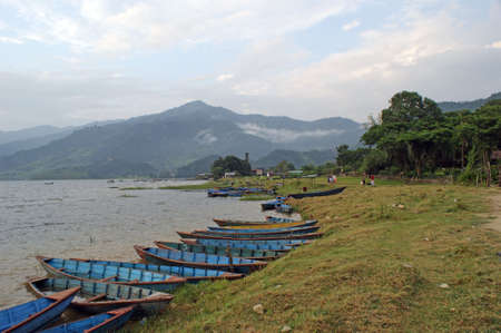 Lake Phewa Tal during the evening next to Pokhara in Nepalの写真素材