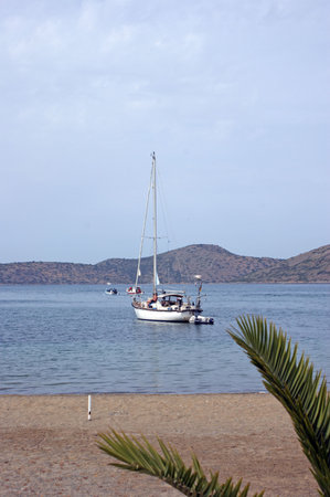 The harbour and small fishing boats in Elounda and the northern part of Creteの写真素材