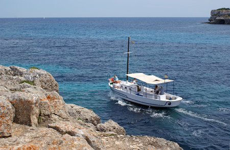 A small boat and a part of Cala Mondrago on the island of Mallorcaの写真素材