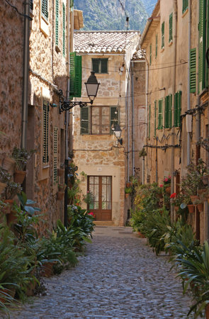 Narrow street in Valldemossa (in Catalan) or Valldemosa (in Spanish) is a village  and municipality...