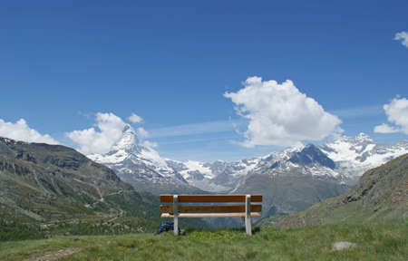 Panoramic view from a bench to the alps in Switzerlandの写真素材