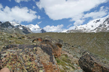 Panoramic view to snowy mountains in the distantの写真素材