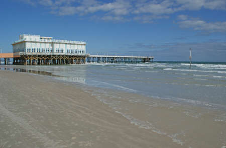 Boardwalk pier on Daytona Beach in the sunshine state of Floridaのeditorial素材