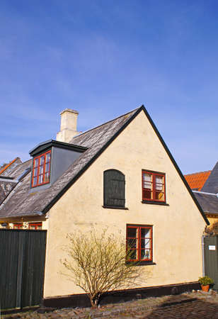 The front of a old house in Dragoer on a sunny dayの写真素材