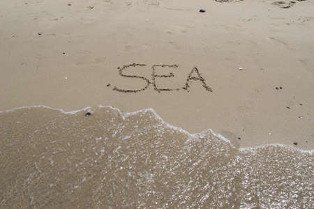 "sea" writing on the foreshoreの写真素材