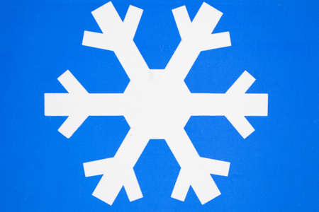 white ice road sign on blue backgroundの写真素材