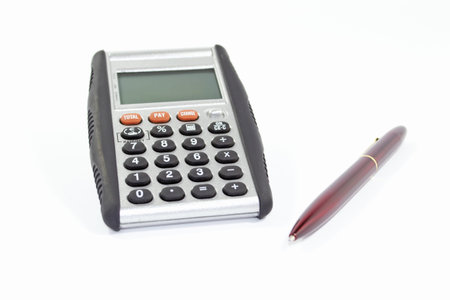 calculator and red pen on white backgroundの写真素材