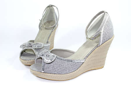 grey wedge-heeled shoes with ankle-straps and spanglesの写真素材