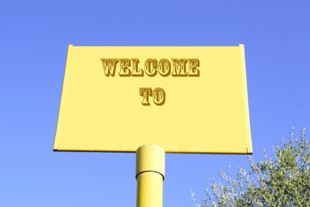 welcome to writing on a yellow sign under a clear blue sky