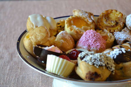 selective focus of colorful pastries in a ceramic bowlの写真素材