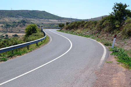 winding road on a clear day in the summertimeの写真素材