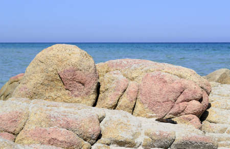 yellow and pink rocks in the BÃ¨rchida shoreline, Sardinia, Italy, の写真素材