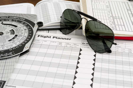 pilot style sunglasses on a flight plan paperの写真素材