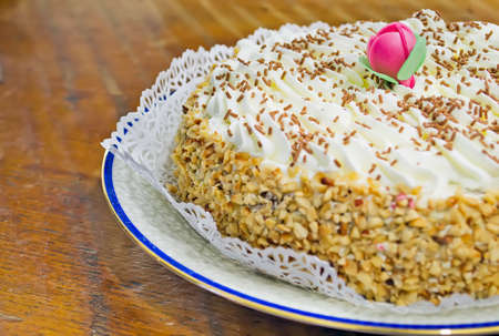 close up of a chantilly cake with a decorative flowerの写真素材