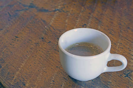 cup of coffee on a wooden tableの写真素材