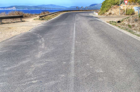 country road between alghero and bosa, sardiniaの写真素材