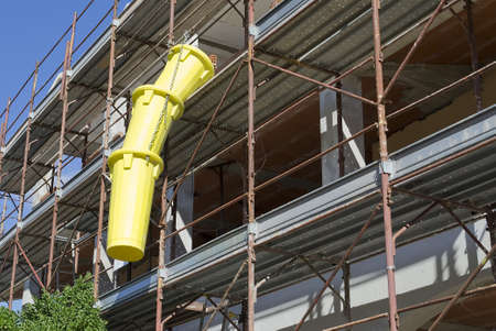 yellow discharge tube in a building siteの写真素材
