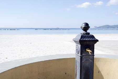 cast iron fountain close to the beachの写真素材