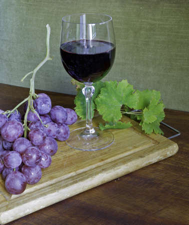 red grape with wine and leafの写真素材
