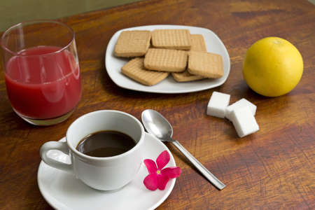 espresso with grapefruit on a wooden tableの写真素材