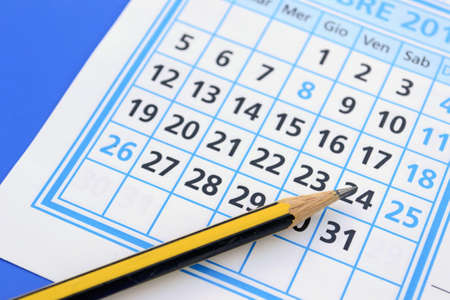pencil on a white and blue calendarの写真素材