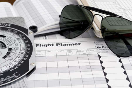 pilot style sunglasses on a flight plan paperの写真素材
