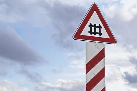 railway sign under a cloudy skyの写真素材