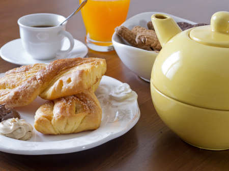 breakfast set with snack, fruit juice, cookies and teaの写真素材
