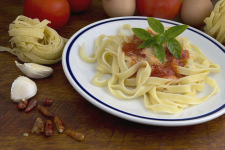 tagliatelle and basil with ingredients all aroundの写真素材